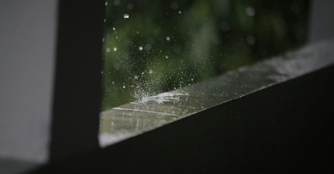 Raindrops Splashing on Wall