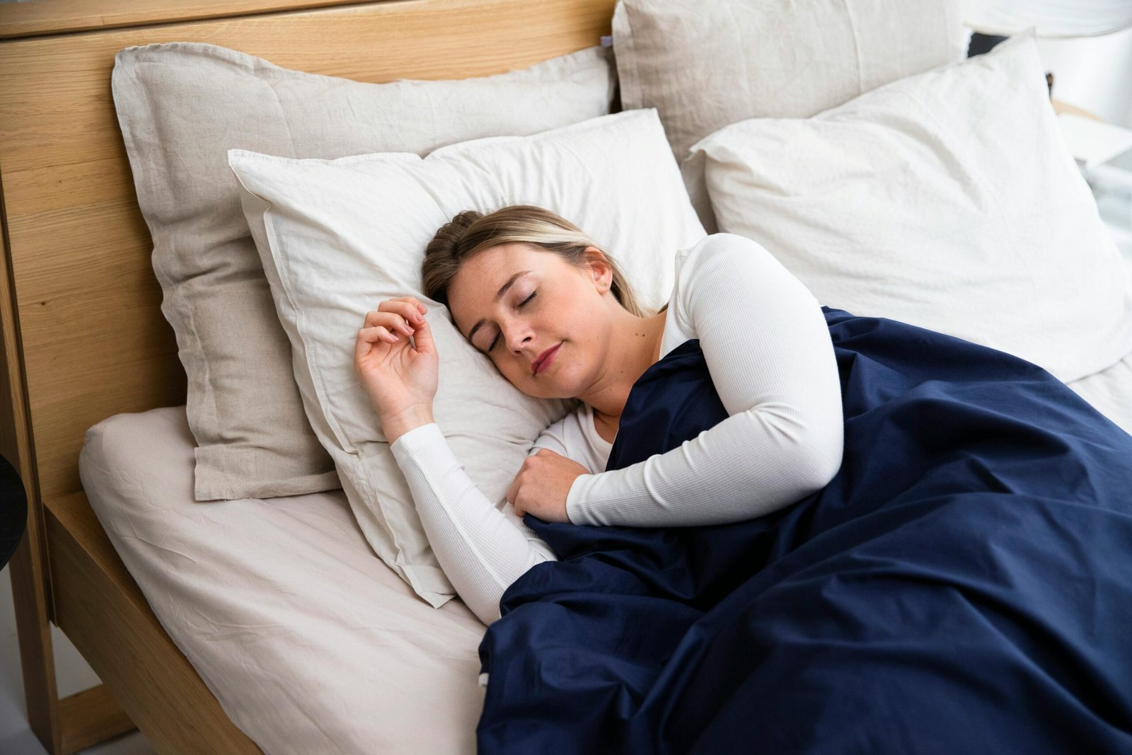 Young Woman Sleeping in Bed